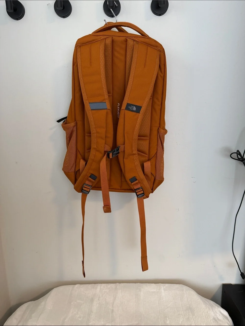 North Face Jester Backpack in burnt orange & black accents Excellent Condition